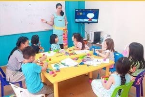 Children engaged in interactive learning in a classroom